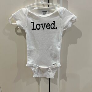 White Baby Onesie with 'Loved' Print